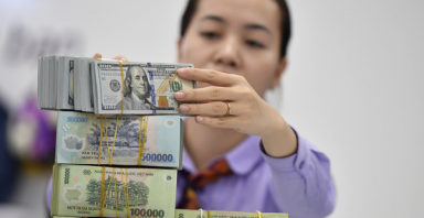 Lý do VNĐ giảm giá dù đồng USD suy yếu
