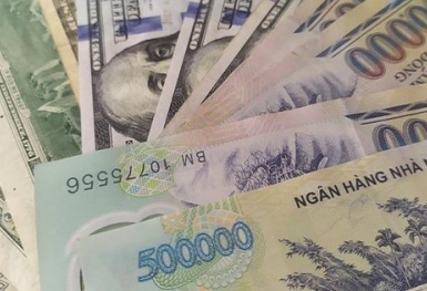 Áp lực giảm giá của VND đã được giảm bớt?