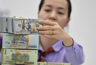 Lý do VNĐ giảm giá dù đồng USD suy yếu