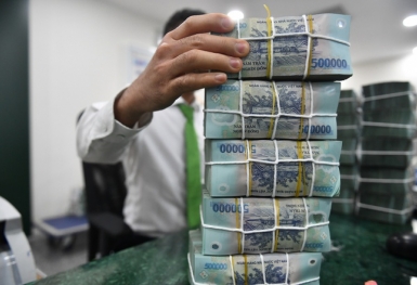 Lợi nhuận nhiều ngân hàng tăng mạnh nhờ cắt giảm trích lập dự phòng rủi ro