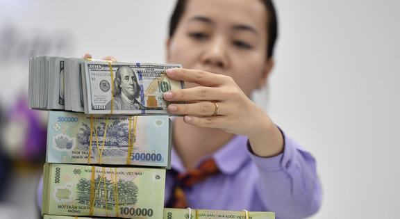 Lý do VNĐ giảm giá dù đồng USD suy yếu